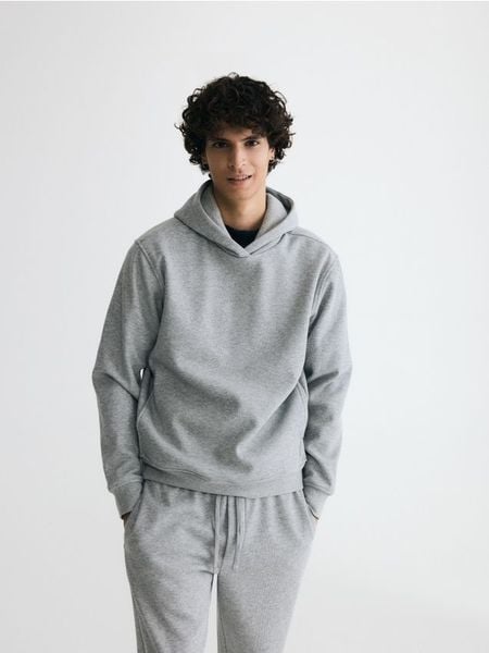 Bluza regular z kapturem - jasnoszary. Szare bluzy męskie Reserved, l, bez wzorów, z bawełny, z kapturem. Za 129.99 zł.