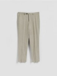 Spodnie garniturowe slim fit - oliwkowy. Zielone eleganckie spodnie męskie Reserved, l, bez wzorów, z tkaniny. Za 169.99 zł.