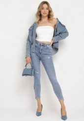 Jasnoniebieskie Bawełniane Jeansy Skinny z Przetarciami Erliaxa. Niebieskie jeansy damskie Born2be. Za 89.99 zł.