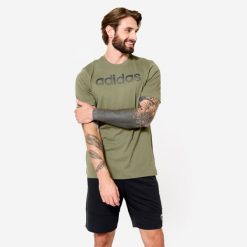 Koszulka męska ADIDAS Gym & Pilates. Zielone koszulki sportowe męskie Adidas, m, bez wzorów, z bawełny, bez kołnierzyka, bez ramiączek, na jogę i pilates. Za 89.99 zł.