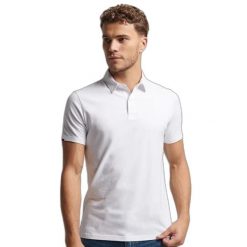 Koszulka polo z dżerseju Superdry Studios. Białe koszulki polo męskie Superdry., xl, bez wzorów, z bawełny, bez ramiączek. Za 226.25 zł.