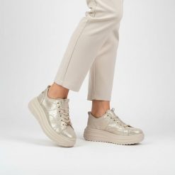 Sneakersy damskie Filippo, cholewka skóra naturalna licowa metaliczna sznurowane niska cholewka masywna podeszwa platforma casua, złote, DP6795/26. Żółte półbuty damskie Filippo, bez wzorów, ze skóry, eleganckie, bez obcasa, na platformie, bez zapięcia. Za 209.00 zł.