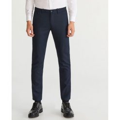 Eleganckie spodnie slim fit - Granatowy. Eleganckie spodnie męskie marki Giacomo Conti. W wyprzedaży za 99.99 zł.