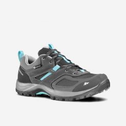 Buty turystyczne damskie Quechua MH100 niskie WTP. Niebieskie obuwie sportowe damskie QUECHUA, trekkingowe. Za 229.99 zł.