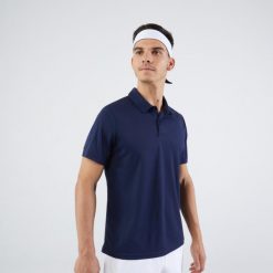 Koszulka polo do tenisa męska Artengo Essential. Niebieskie koszulki polo męskie KUIKMA, m, bez wzorów, z materiału, bez kołnierzyka, bez ramiączek, tenisowe. Za 29.99 zł.