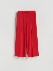 Spodnie w kant z wiskozą - czerwony. Czerwone spodnie materiałowe damskie Reserved, l, bez wzorów, z tkaniny. Za 139.99 zł.