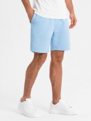 Szorty dresowe unisex ze ściągaczem w pasie błękitne V8 OU-SRBC-0101 XS/S. Niebieskie szorty sportowe damskie Ombre, s, bez wzorów, z dresówki, sportowe. Za 408.47 zł.