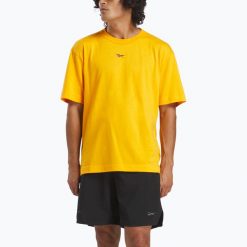 Koszulka Reebok Atlethe Hype Tee. Żółte buty sportowe męskie REEBOK FITNESS, bez wzorów, bez kołnierzyka, bez ramiączek, na fitness i siłownię. Za 129.99 zł.