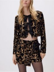 Cekinowa marynarka z kokardami - czarny. Czarne żakiety damskie Reserved, l, bez wzorów, z dzianiny. Za 179.99 zł.