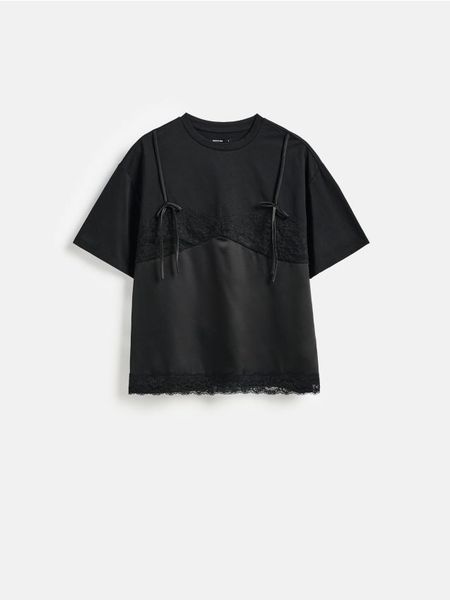 T-shirt z bawełną - czarny. Czarne t-shirty damskie Reserved, l, bez wzorów, z bawełny, bez kołnierzyka. Za 99.99 zł.