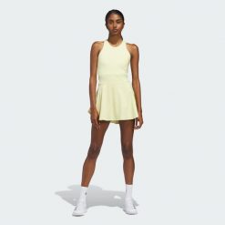 Sukienka Tennis Climacool Y-Dress. Żółte koszulki sportowe damskie Adidas, bez wzorów, bez kołnierzyka, bez ramiączek, tenisowe, climacool (adidas). W wyprzedaży za 299.35 zł.
