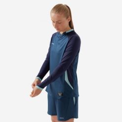 Koszulka do piłki nożnej z długim rękawem damska Kipsta krój slim. Niebieskie koszulki sportowe damskie KIPSTA, xl, bez wzorów, z materiału, bez kołnierzyka, bez ramiączek, do piłki nożnej. Za 129.99 zł.