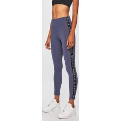 Nike Sportswear - Legginsy. Fioletowe legginsy damskie Nike Sportswear, l, bez wzorów, z bawełny. Za 139.90 zł.