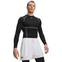 Under Armour Męska Koszulka HG Elite Comp LS 6015384. Czarne koszulki sportowe męskie Under Armour, l, bez wzorów, z elastanu, bez kołnierzyka, bez ramiączek, na fitness i siłownię. Za 248.60 zł.