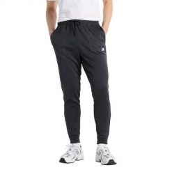 Spodnie treningowe męskie New Balance MP51905BK. Szare spodnie sportowe męskie New Balance, m, bez wzorów, z dresówki, na fitness i siłownię. Za 249.00 zł.