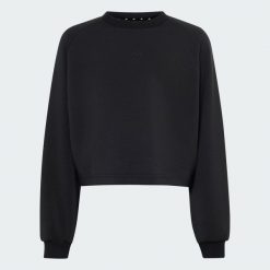 BLUZA ADIDAS DLA DZIEWCZĄT. Fioletowe bluzy dla dziewczynek Adidas, bez wzorów, z elastanu, bez ramiączek, bez kaptura. Za 179.00 zł.