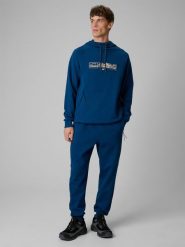 4F Spodnie dresowe joggery męskie - turkusowe M. Niebieskie spodnie sportowe męskie 4f, m, bez wzorów, z dresówki, na fitness i siłownię. Za 159.99 zł.