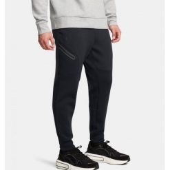 Spodnie męskie Under Armour Unstoppable Fleece. Czarne buty sportowe męskie Under Armour, m, bez wzorów, na fitness i siłownię. Za 379.99 zł.