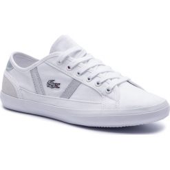 Tenisówki LACOSTE - Sideline 219 1 Cfa 7-37CFA004321G Wht/Wht. Białe półbuty damskie Lacoste, bez wzorów, z gumy, bez obcasa, bez zapięcia. W wyprzedaży za 239.00 zł.
