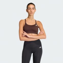 Biustonosz Optime Essentials Workout Light Support. Czarne biustonosze Adidas, bez wzorów, z elastanu. Za 149.00 zł.