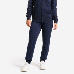 Spodnie dresowe fitness damskie Domyos slim. Niebieskie spodnie dresowe damskie DOMYOS, l, bez wzorów, z dresówki. Za 99.99 zł.