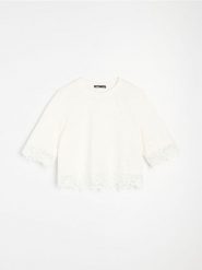 Bawełniana bluzka z koronkową aplikacją - kremowy. Białe bluzki damskie Sinsay, l, z aplikacjami, z bawełny, bez kołnierzyka, bez ramiączek. Za 29.99 zł.