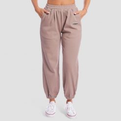 Spodnie dresowe damskie oversize z kieszeniami Roux Aura. Brązowe spodnie dresowe damskie GYMBEAM, s, bez wzorów, z bawełny. Za 131.90 zł.