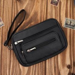 Saszetka męska skórzana do ręki elegancka klasyczna czarna Abruzzo ABR-50. Czarne saszetki męskie ze skóry, eleganckie. Za 99.00 zł.