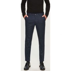 Spodnie na kant slim fit - Granatowy. Niebieskie eleganckie spodnie męskie Reserved. Za 149.99 zł.