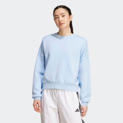Sweat-shirt de fitness femme, bleu clair. Bluzy sportowe damskie Adidas, s, bez wzorów, z bawełny, bez kaptura, na fitness i siłownię. Za 199.99 zł.