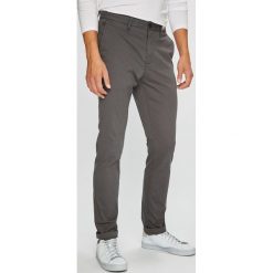 Tommy Hilfiger - Spodnie 867895043. Szare eleganckie spodnie męskie Tommy Hilfiger, bez wzorów, z tkaniny. W wyprzedaży za 459.90 zł.