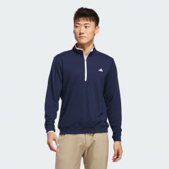 Koszulka Lightweight Half-Zip. Białe koszulki sportowe męskie Adidas, uniwersalny, bez wzorów, z materiału, bez kołnierzyka, bez ramiączek, na golfa. Za 279.00 zł.