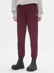 Reebok Spodnie dresowe Classics Franchise IL4627 Bordowy Relaxed Fit. Czerwone spodnie dresowe damskie Reebok, m, bez wzorów, z dresówki. Za 159.99 zł.