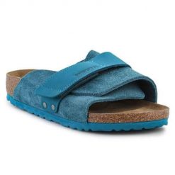 Klapki damskie Birkenstock Kyoto. Niebieskie klapki damskie Birkenstock, bez wzorów, z materiału, bez obcasa. Za 785.95 zł.