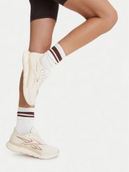 Reebok Buty na siłownię EO-NANO GYM 2.0 100276197 Kremowy. Białe obuwie sportowe damskie Reebok, bez wzorów, z materiału, na fitness i siłownię. Za 399.99 zł.