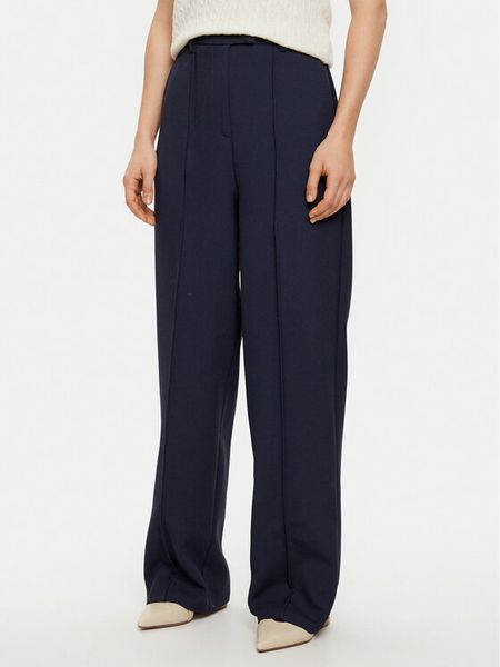 Tommy Hilfiger Spodnie materiałowe WW0WW43875 Granatowy Regular Fit. Niebieskie spodnie materiałowe damskie Tommy Hilfiger, bez wzorów, z materiału. Za 379.99 zł.