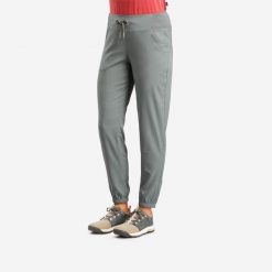 Spodnie turystyczne damskie Quechua NH100. Brązowe spodnie sportowe damskie QUECHUA, xs, bez wzorów, z materiału, trekkingowe. W wyprzedaży za 49.99 zł.