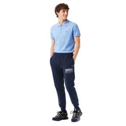 Spodnie turystyczne męskie Lacoste. Niebieskie spodnie sportowe męskie Lacoste, na lato, m, z aplikacjami, z dresówki, trekkingowe. Za 327.00 zł.