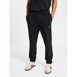 Spodnie do biegania Hummel Pulse. Czarne buty sportowe męskie Hummel, z dresówki, bez zapięcia, do biegania. Za 170.00 zł.