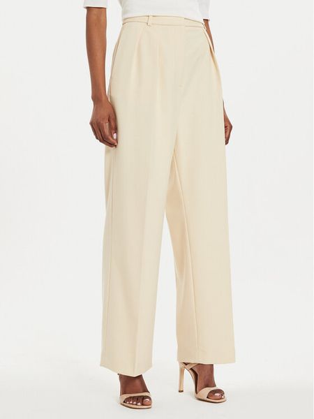 Tommy Hilfiger Spodnie materiałowe Core WW0WW39725 Beżowy Relaxed Fit. Brązowe spodnie materiałowe damskie Tommy Hilfiger, bez wzorów, z materiału. Za 399.99 zł.