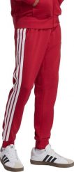 Adidas Spodnie męskie adidas Essential 3-Stripes French Terry bordowe KR2702 XL. Czerwone spodnie sportowe męskie Adidas, m, bez wzorów. Za 236.51 zł.