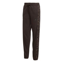 Damskie spodnie dresowe z nadrukiem w panterkę adidas Essentials. Brązowe spodnie dresowe damskie Adidas, l, bez wzorów, z dresówki. Za 226.50 zł.