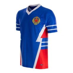 Koszulka piłkarska retro dla dorosłych Jugosławia 1990 - Niebieska. Niebieskie koszulki sportowe męskie COPA FOOTBALL, l, bez wzorów, z materiału, bez kołnierzyka, bez ramiączek, do piłki nożnej. Za 301.22 zł.