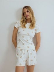 Dwuczęściowa piżama z bawełną - złamana biel. Piżamy damskie Reserved, l, bez wzorów, z bawełny, bez ramiączek. Za 89.99 zł.