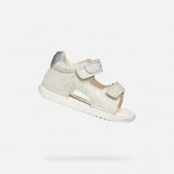 Sandały GEOX B SANDAL MACCHIA GIR Biały. Białe sandały damskie Geox, bez wzorów, ze skóry, bez obcasa, bez zapięcia. Za 219.99 zł.