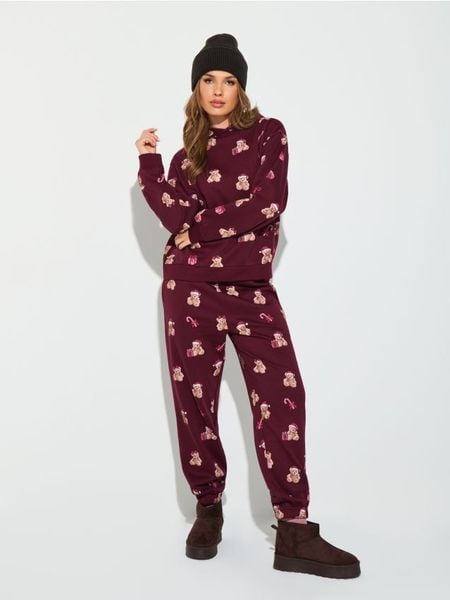 Spodnie jogger ze wzorem - bordowy. Czerwone spodnie materiałowe damskie Sinsay, l, bez wzorów. Za 39.99 zł.