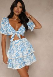 Niebieski Komplet Bluzka Ozdobiona Wiązaniem i Spódnica z Lamówką Halanisa. Niebieskie bluzki damskie Renee, m, z aplikacjami, eleganckie, proste. Za 189.99 zł.