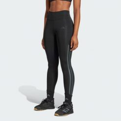 Długie legginsy Optimé 3-Stripes. Czarne legginsy damskie Adidas, l, bez wzorów. Za 248.85 zł.
