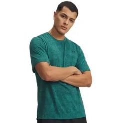 Koszulka Under Armour Tech. Czarne koszulki sportowe męskie Under Armour, m, z aplikacjami, z materiału, bez kołnierzyka, bez ramiączek, na fitness i siłownię. Za 169.55 zł.