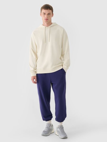 4F Spodnie dresowe joggery męskie - granatowe S. Niebieskie spodnie sportowe męskie 4f, l, bez wzorów, z bawełny. Za 149.99 zł.